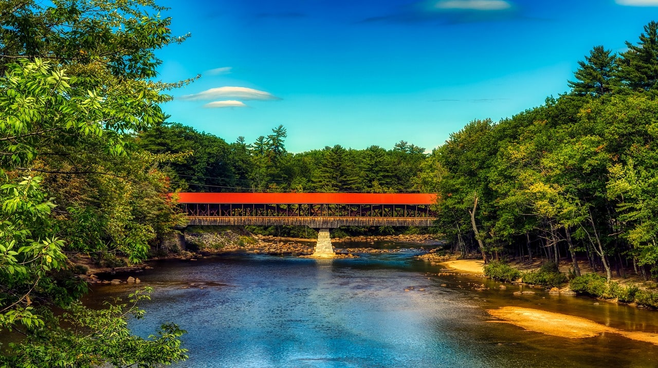 A covered wooden bridge over the Saco River in New Hampshire
