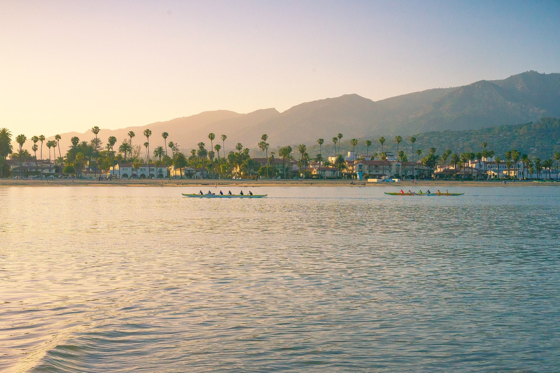 Santa Barbara waterfront and palm trees at sunset