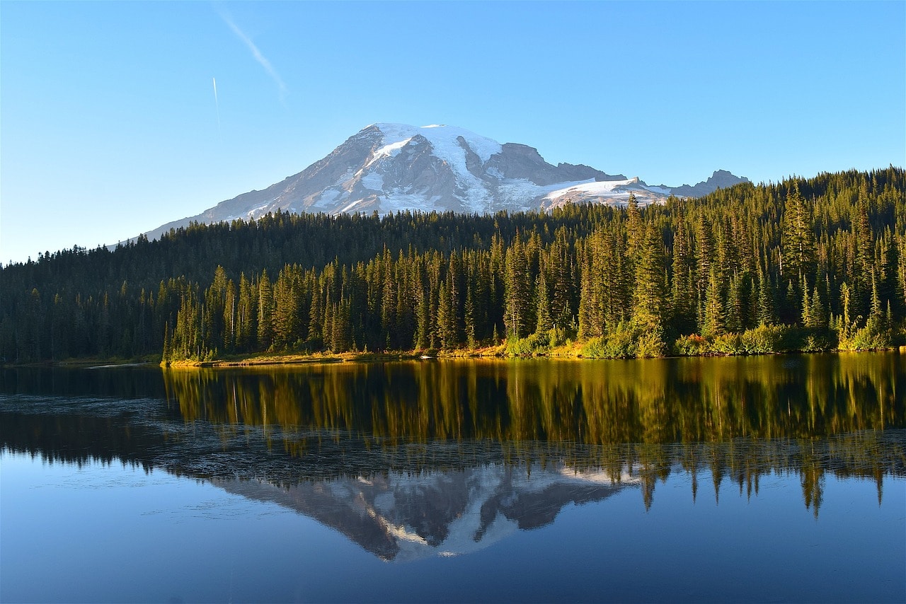 Reflection of Mount Rainier’s summit in an alpine lake
